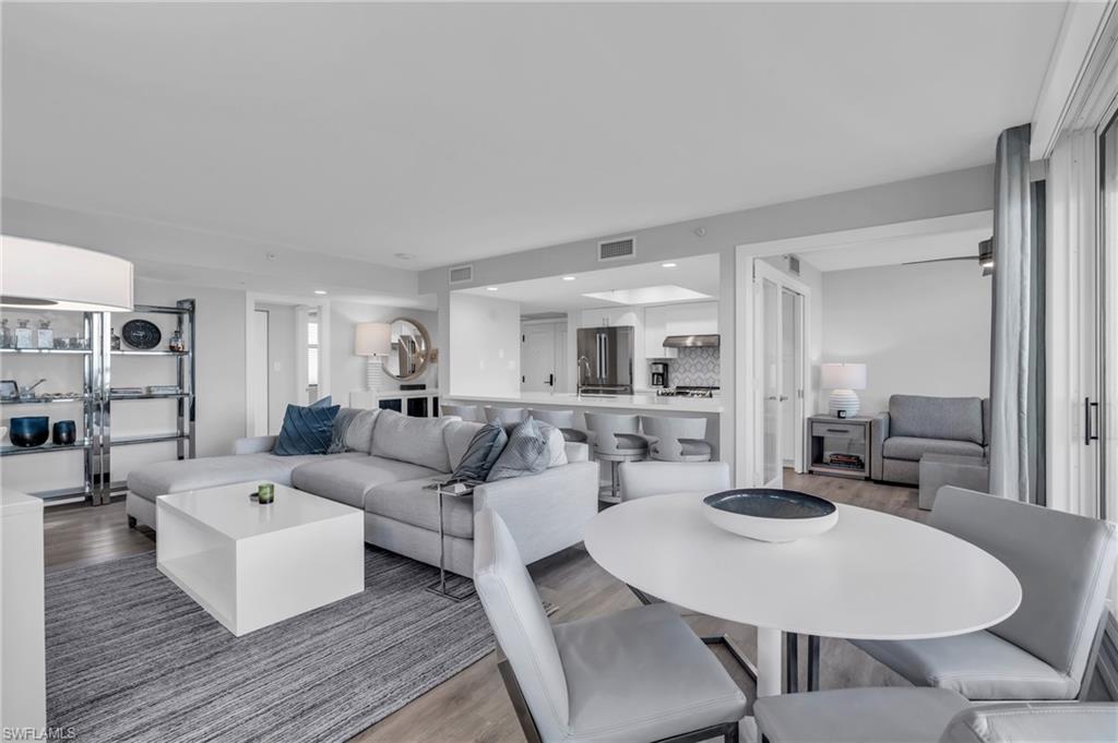 6573 Marissa Loop, Unit 1403 Naples, FL 34108 - Photo 6 of 29 a living room with furniture and wooden floor