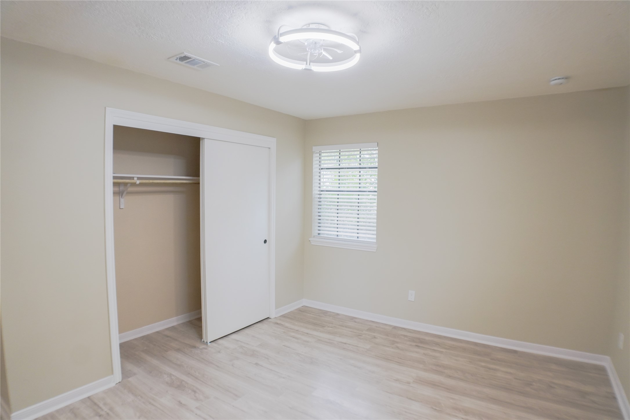 2401 Sycamore Avenue, Unit B2 Huntsville, TX 77340 - Photo 11 of 17 a view of an empty room with a window
