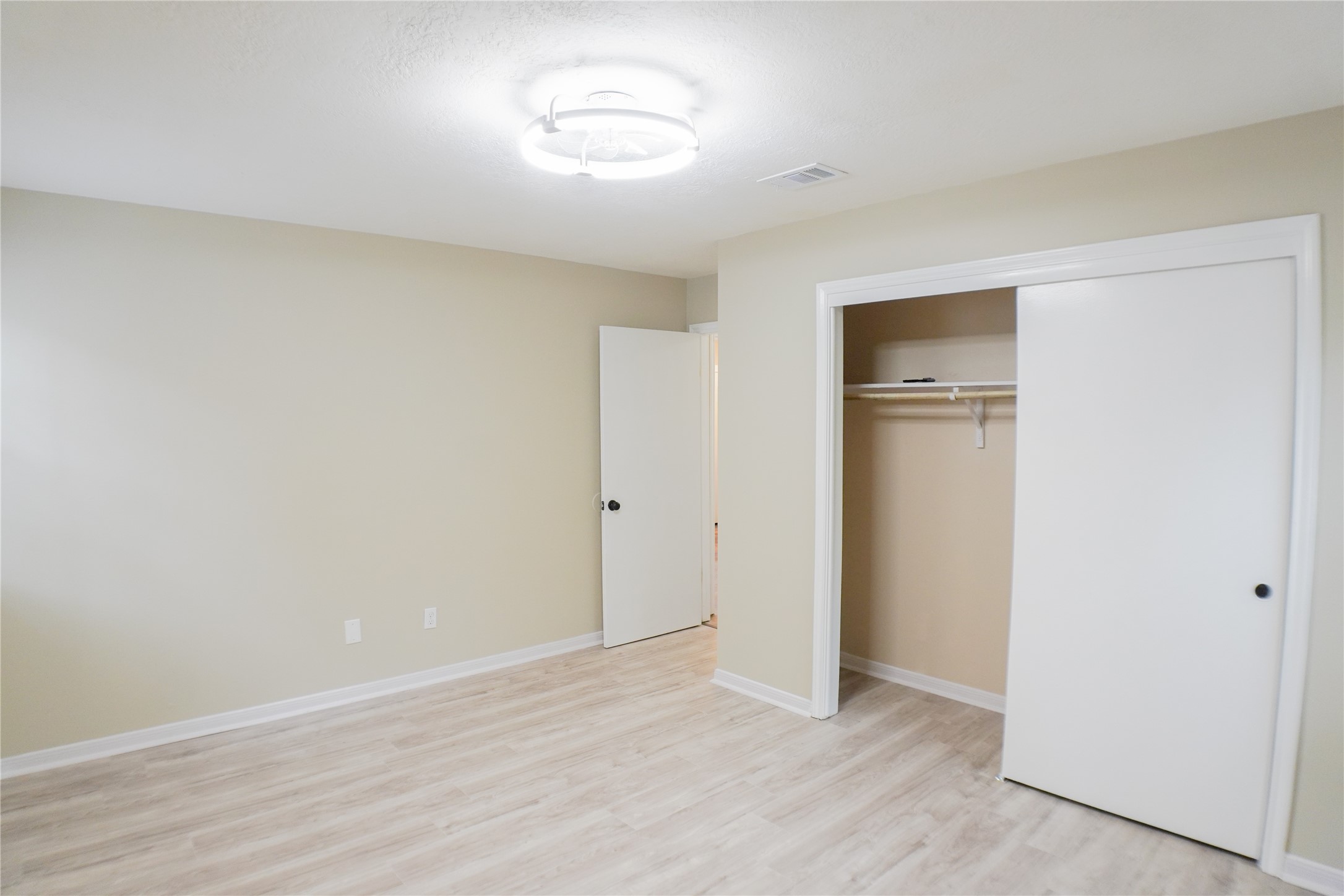 2401 Sycamore Avenue, Unit B2 Huntsville, TX 77340 - Photo 12 of 17 a view of an empty room with a window
