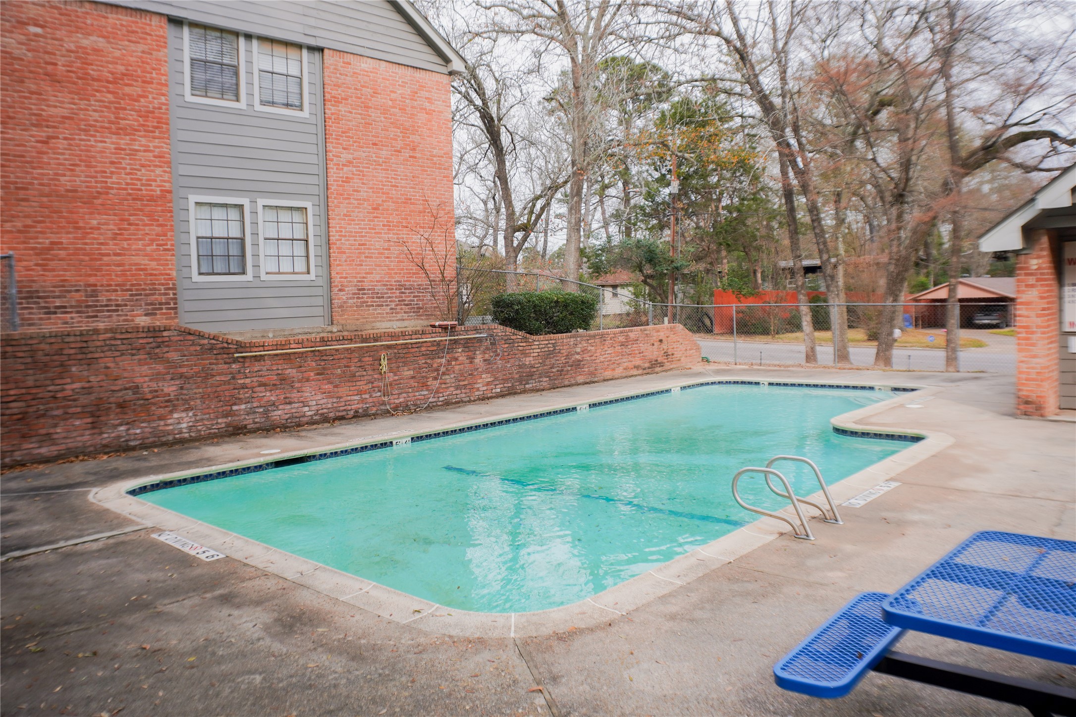 2401 Sycamore Avenue, Unit B2 Huntsville, TX 77340 - Photo 17 of 17 a view of a backyard with a barbeque grill