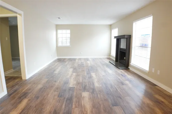 a view of a livingroom with wooden floor