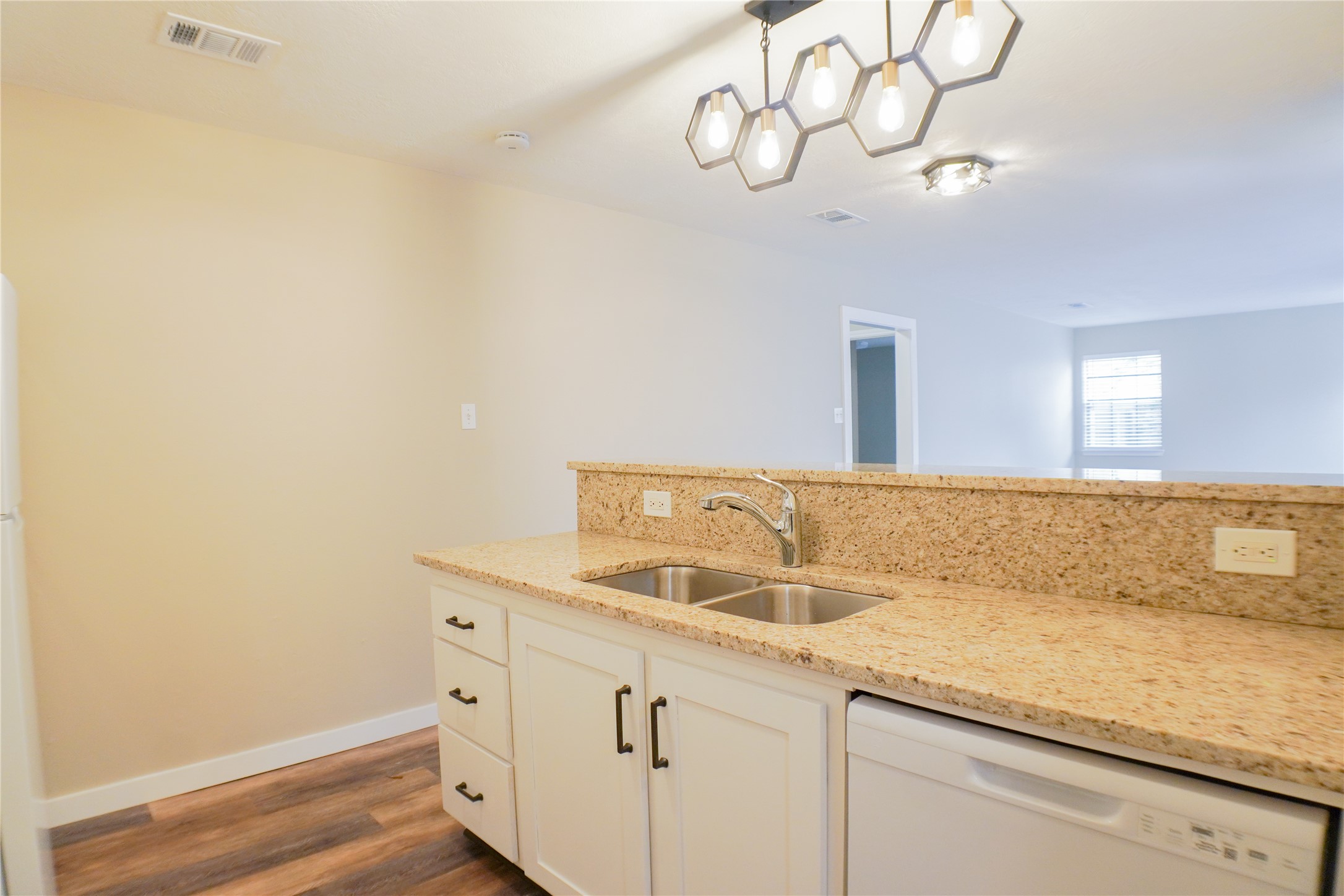 2401 Sycamore Avenue, Unit B2 Huntsville, TX 77340 - Photo 8 of 17 a bathroom with a sink and a mirror