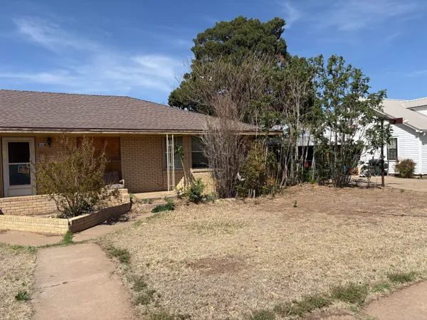 a front view of a house with a outdoor space