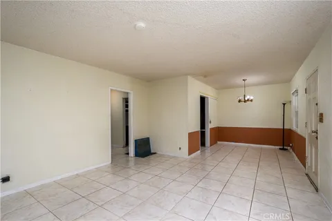 a view of a kitchen with microwave and cabinets