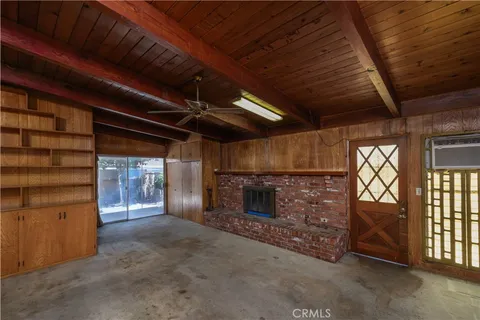 a view of an empty room with a fireplace
