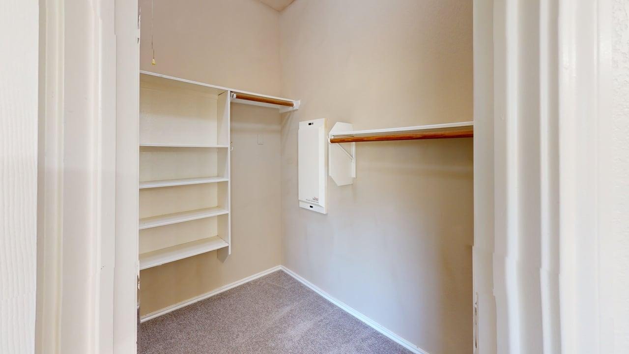 1716 Rosenborough Lane South Round Rock, TX 78665 - Photo 11 of 26 a view of walk in closet with empty racks