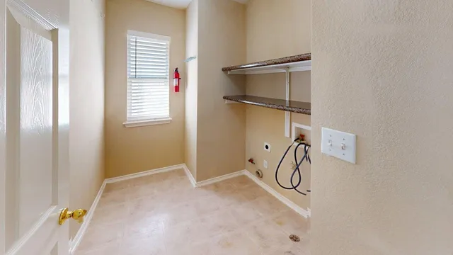 a bathroom with a granite countertop shower and a window