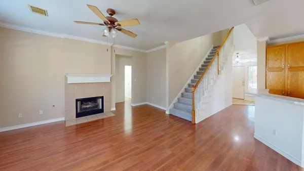 a view of a livingroom with a fireplace and window