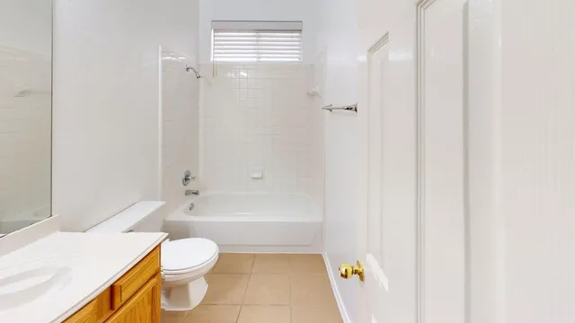 a bathroom with a bathtub and toilet