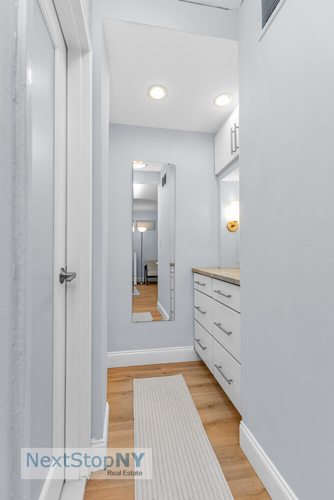 520 East 76th Street, Unit 1F Manhattan, NY 10021 - Photo 7 of 10 a bathroom with a sink and a mirror