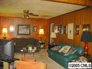 4200 Cheltenham Road Charlotte, NC 28211 - Photo 4 of 8 a living room with furniture and a lamp