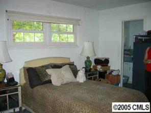 4200 Cheltenham Road Charlotte, NC 28211 - Photo 6 of 8 a bedroom with a bed and a window