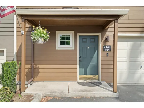 a side view of a house with a patio