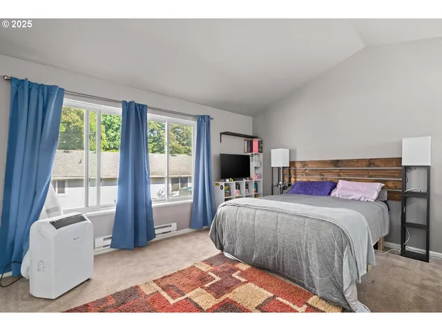 a bedroom with a bed and a couch