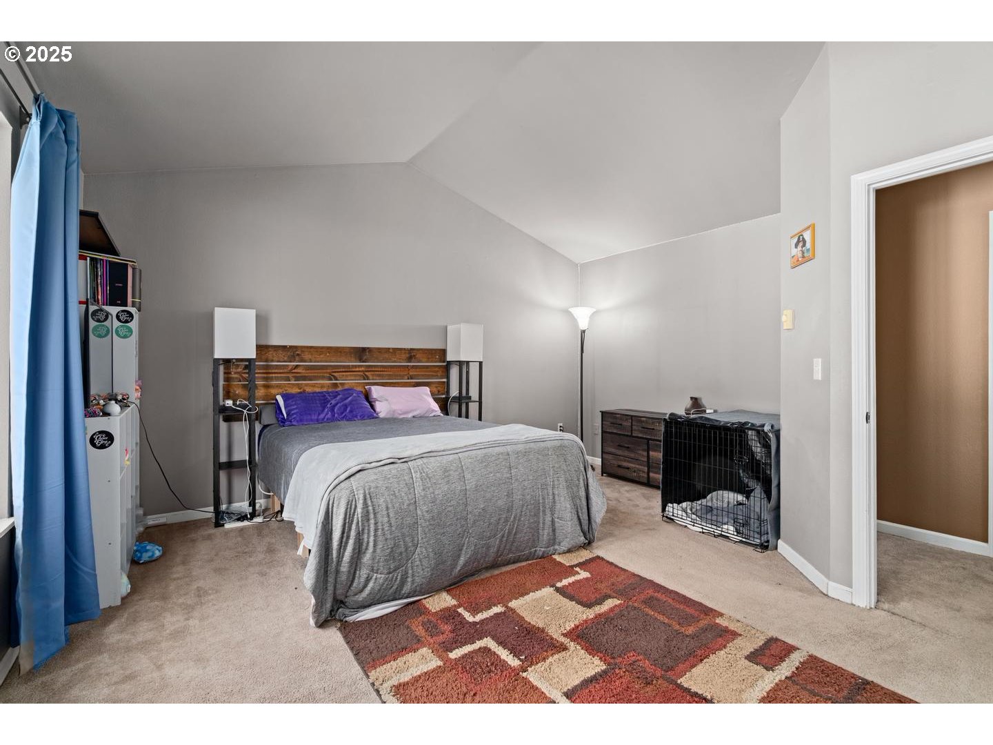 7143 Southwest Sagert Street, Unit 104 Tualatin, OR 97062 - Photo 20 of 33 a bedroom with a bed and wooden floor