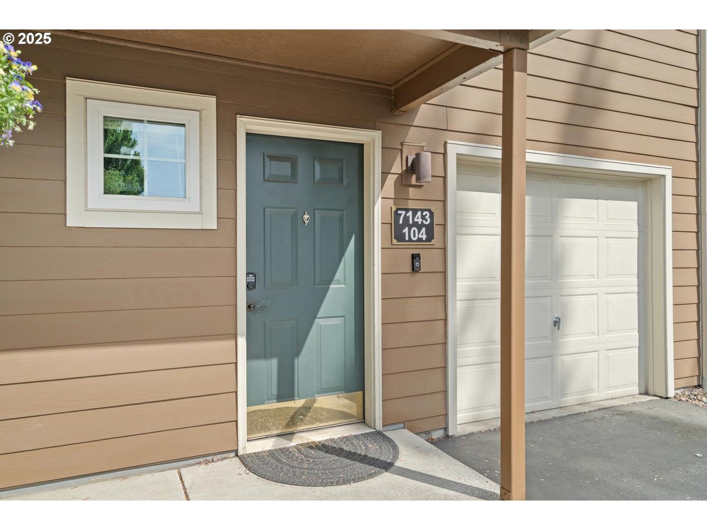 7143 Southwest Sagert Street, Unit 104 Tualatin, OR 97062 - Photo 2 of 33 a view of a door of the house
