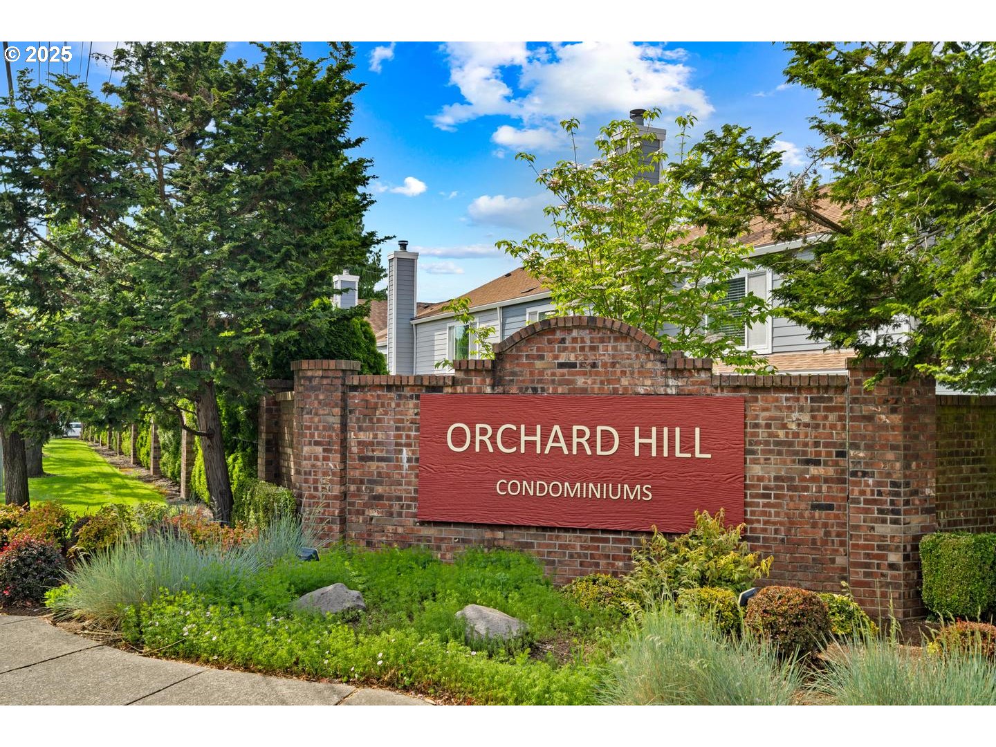 7143 Southwest Sagert Street, Unit 104 Tualatin, OR 97062 - Photo 27 of 33 a sign on the side of a building