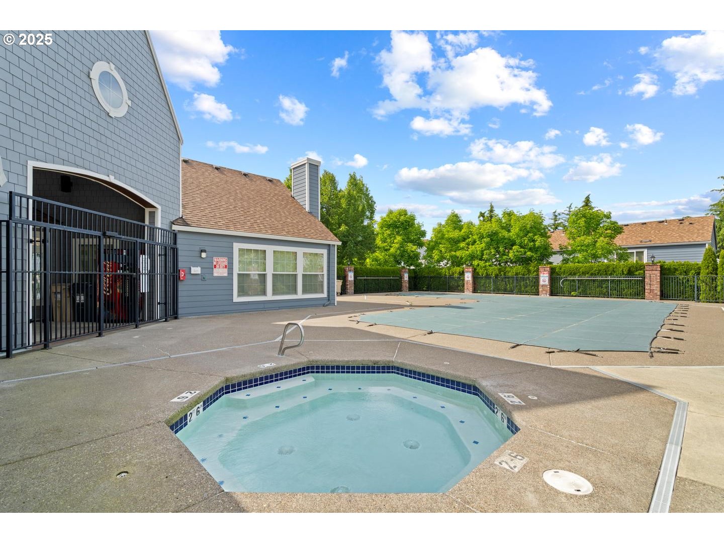 7143 Southwest Sagert Street, Unit 104 Tualatin, OR 97062 - Photo 28 of 33 a view of a house with a backyard and a patio