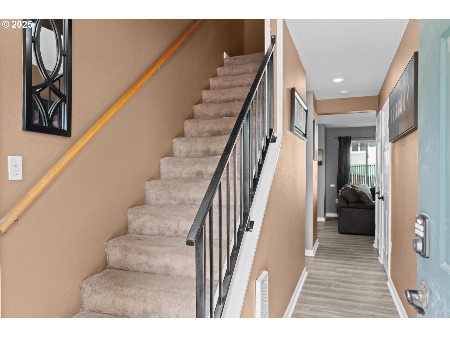 7143 Southwest Sagert Street, Unit 104 Tualatin, OR 97062 - Photo 4 of 33 a view of entryway and hall with wooden floor