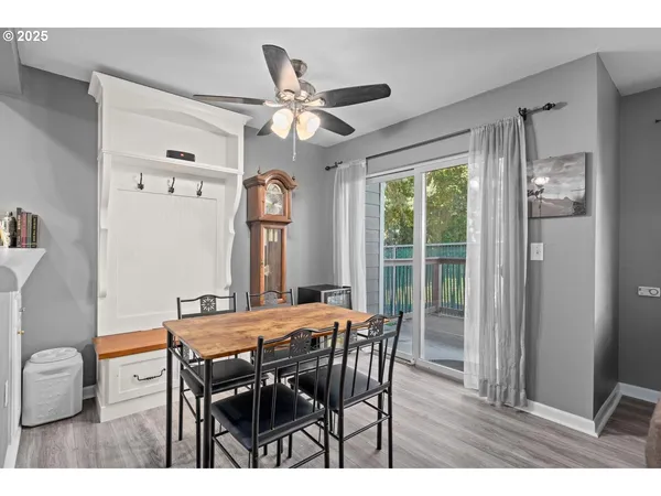 a view of a dining room with furniture window and wooden floor