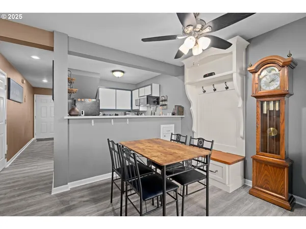 a dining room with furniture and window