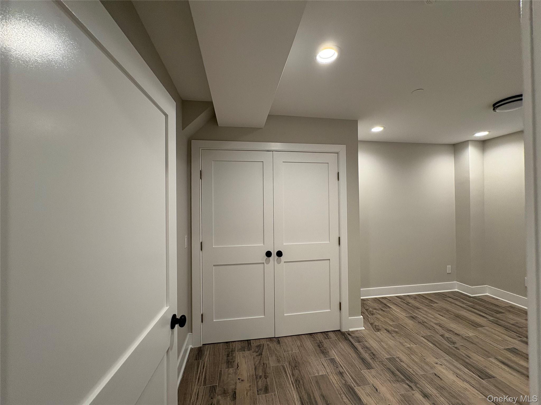 455 Sunrise Highway, Unit 1A West Babylon, NY 11704 - Photo 8 of 15 a view of room with wooden floor