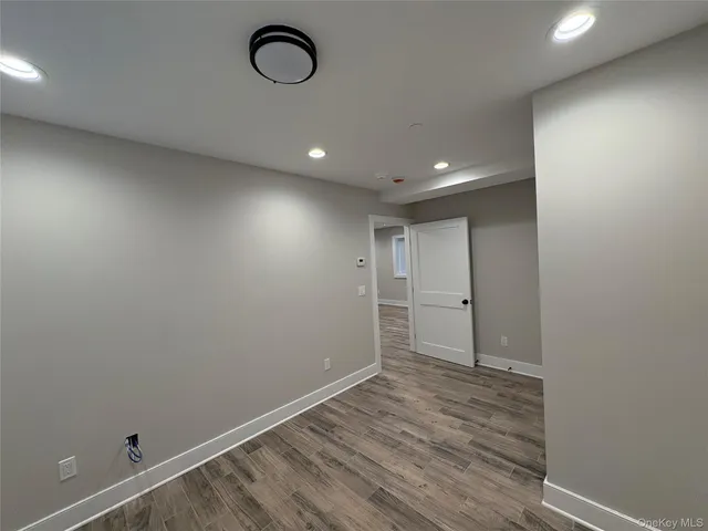 a view of room with wooden floor