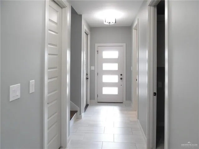 a view of a hallway with two rooms