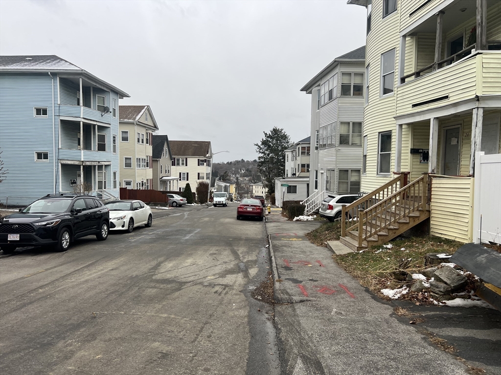 74 Esther Street Worcester, MA 01607 - Photo 4 of 6 a view of a street with cars