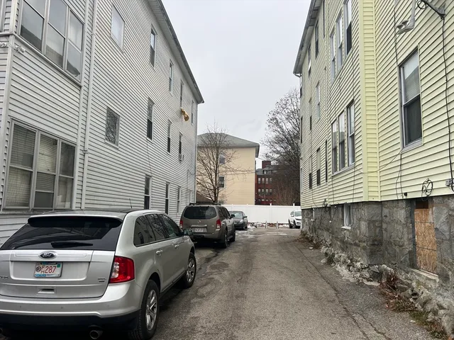 a front view of a house with parking space