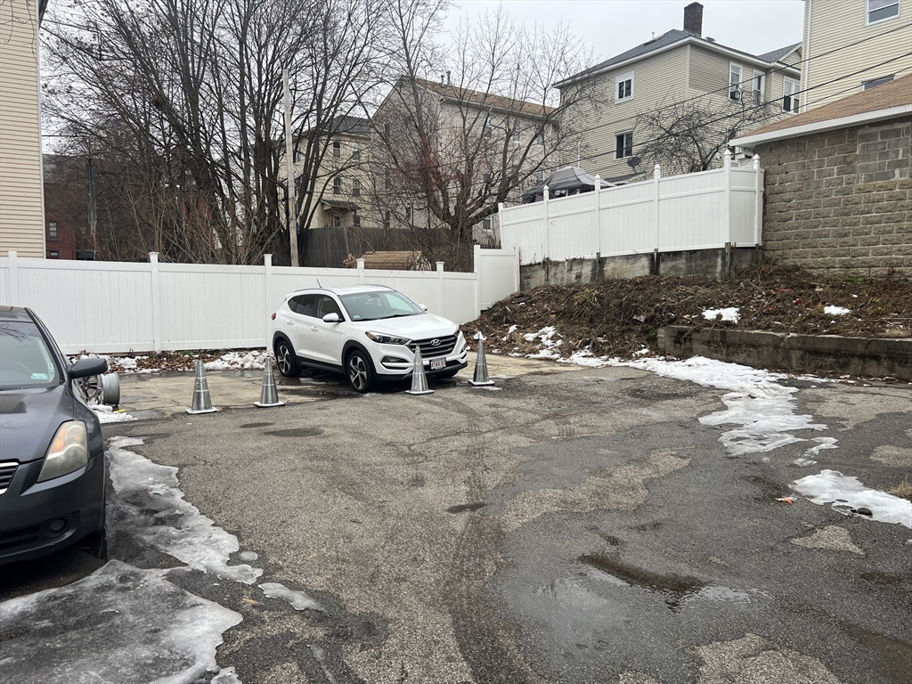 74 Esther Street Worcester, MA 01607 - Photo 5 of 5 a car parked in front of a house
