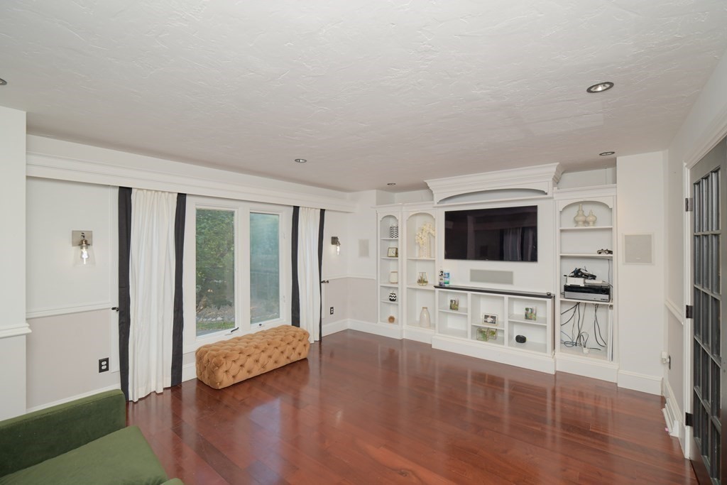885 Randolph Street Canton, MA 02021 - Photo 15 of 40 a spacious bedroom with a bed and a flat screen tv