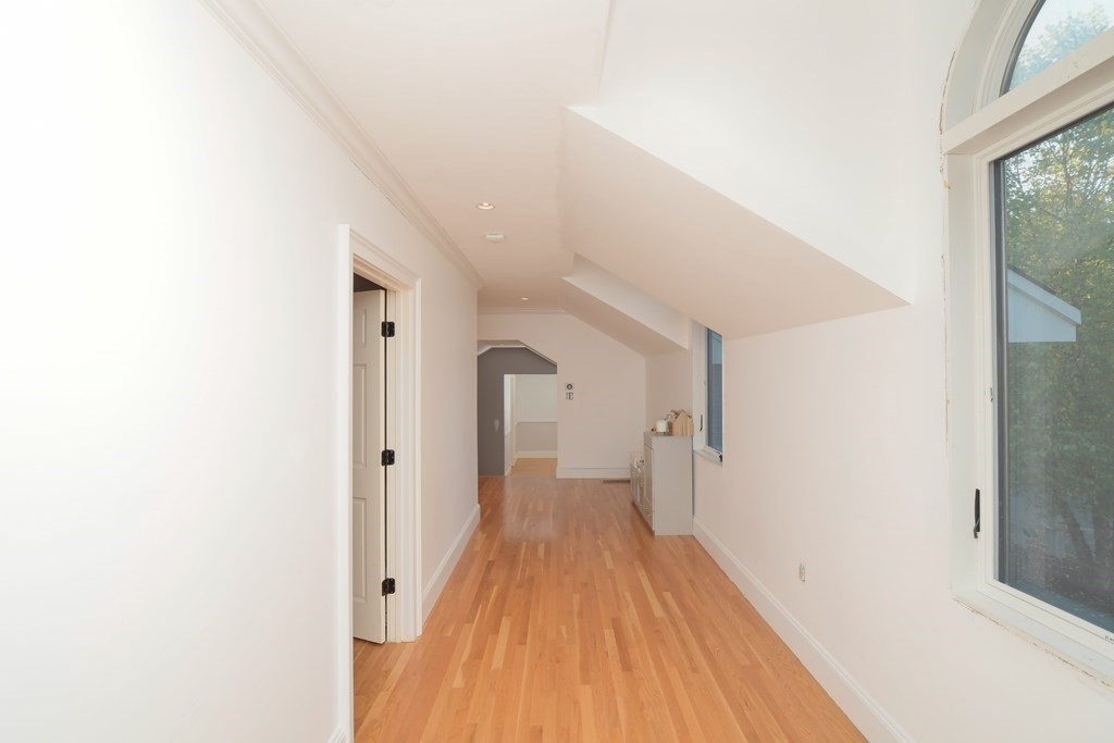 885 Randolph Street Canton, MA 02021 - Photo 20 of 40 a view of a hallway with wooden floor