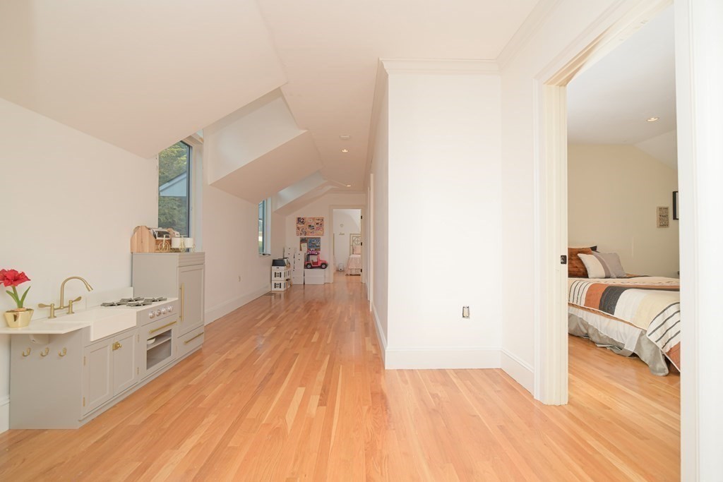 885 Randolph Street Canton, MA 02021 - Photo 21 of 40 a hallway with a wooden floor