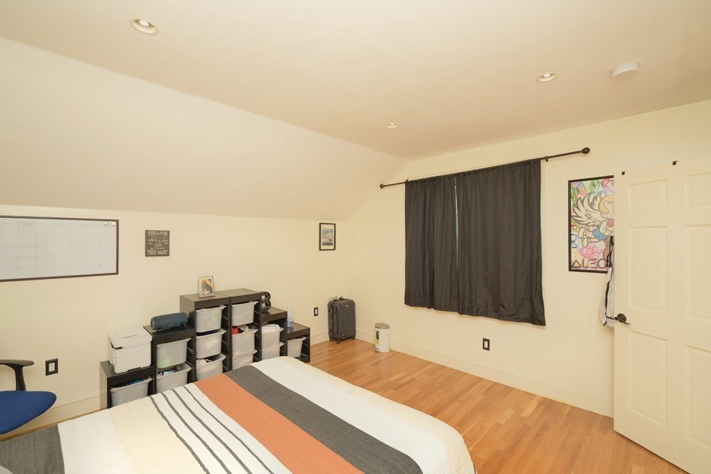 885 Randolph Street Canton, MA 02021 - Photo 23 of 40 a bedroom with a bed and a wall painting