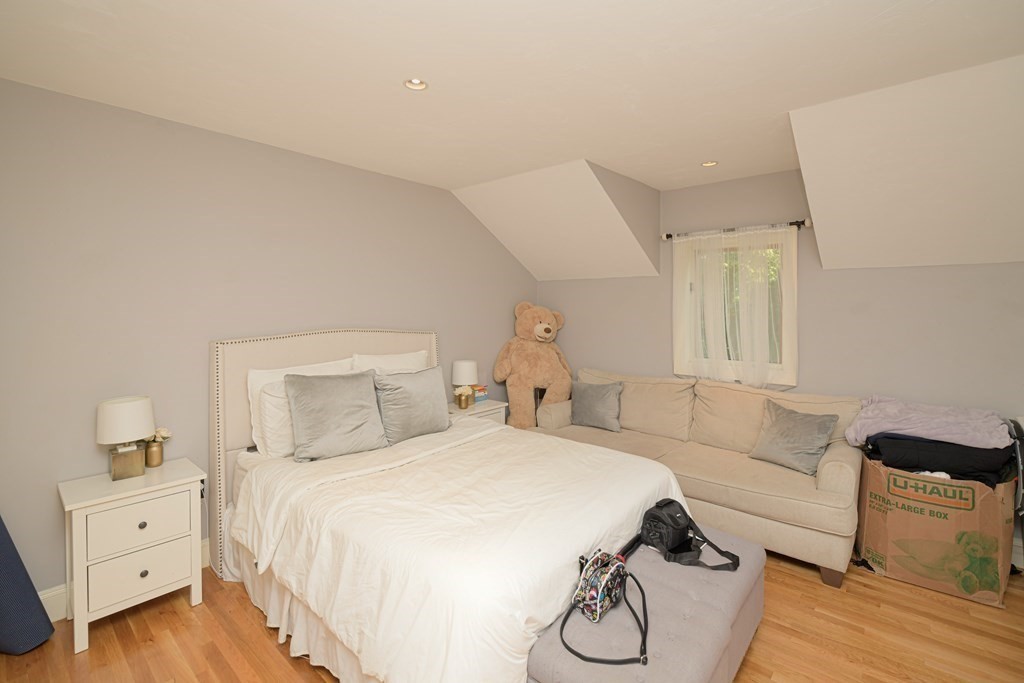 885 Randolph Street Canton, MA 02021 - Photo 24 of 40 a spacious bedroom with a bed and window