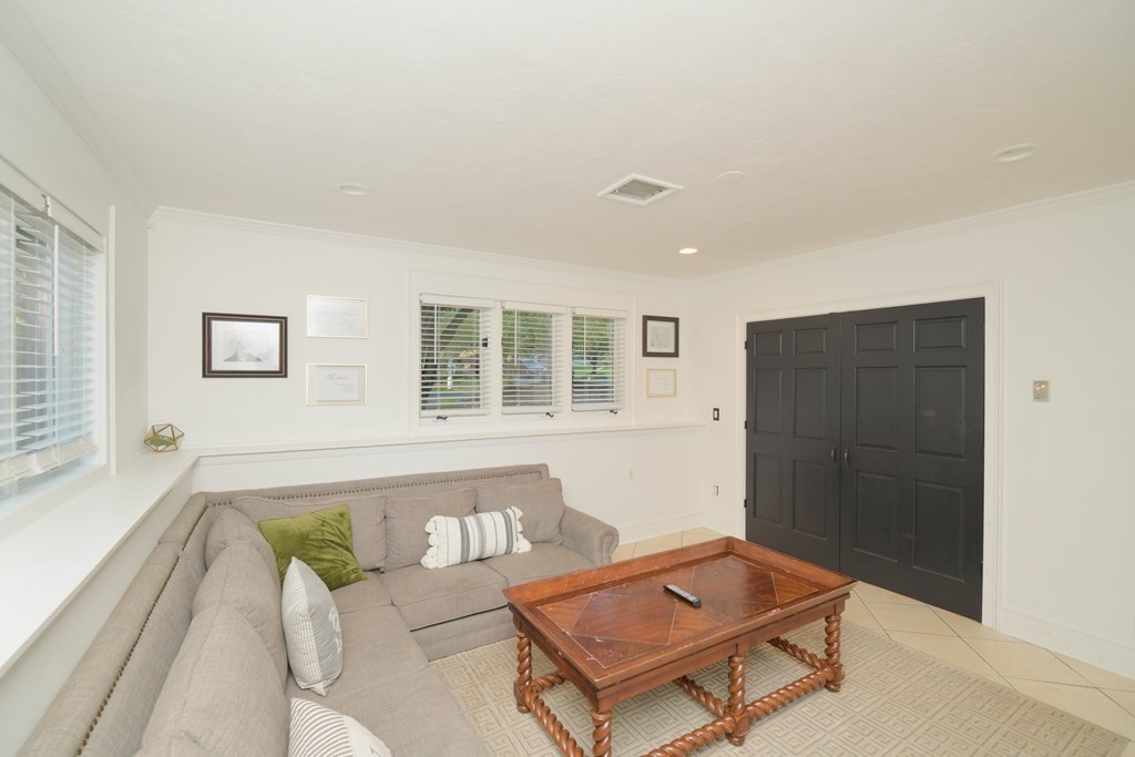 885 Randolph Street Canton, MA 02021 - Photo 28 of 40 a living room with furniture and a window