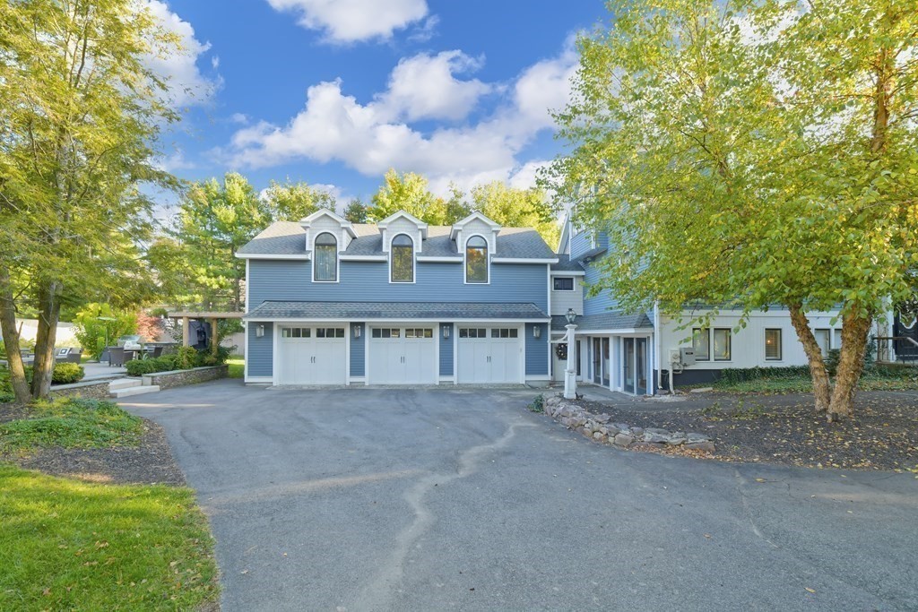 885 Randolph Street Canton, MA 02021 - Photo 35 of 40 a front view of a house with a yard and garage