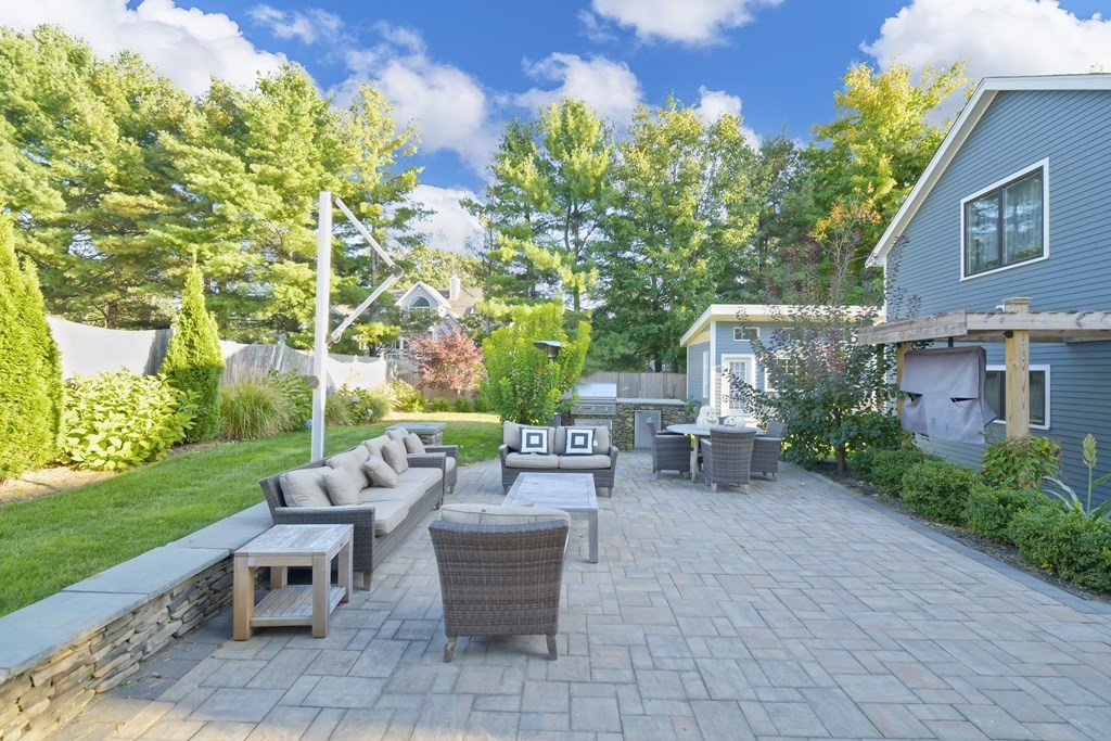885 Randolph Street Canton, MA 02021 - Photo 38 of 40 a view of a patio with table and chairs potted plants and a large tree
