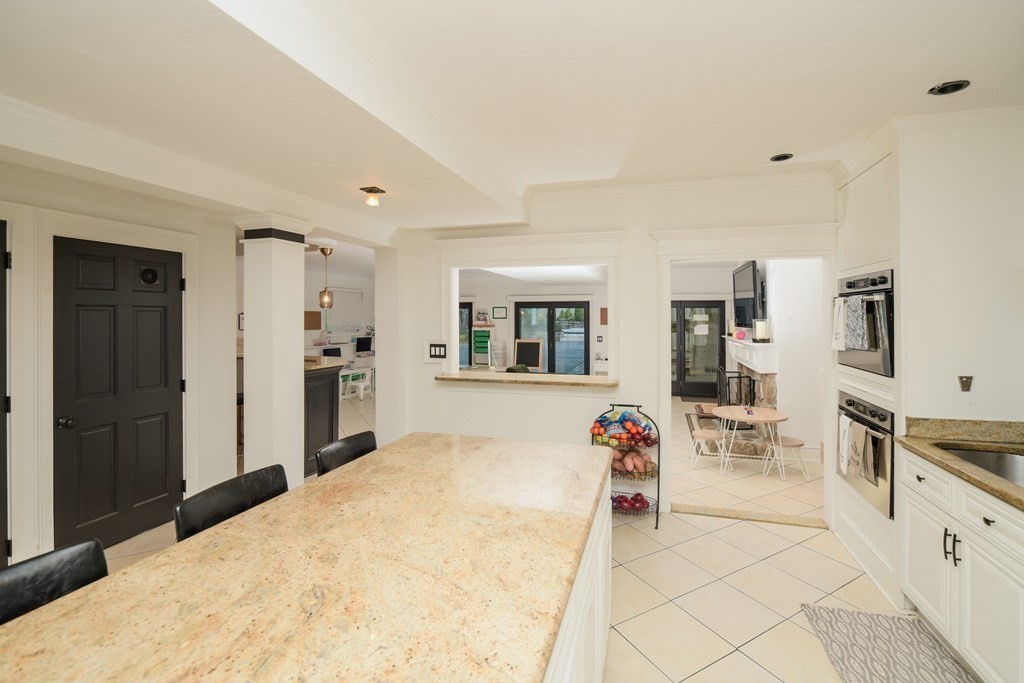 885 Randolph Street Canton, MA 02021 - Photo 6 of 40 a living room with furniture and a flat screen tv