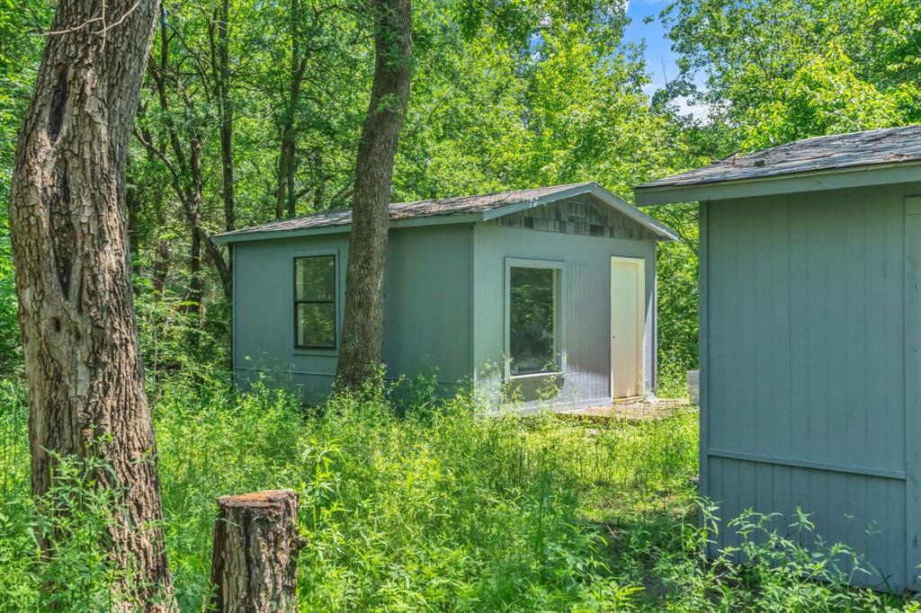84 Natchez Road Pottsboro, TX 75076 - Photo 35 of 37 front view of a house with a yard