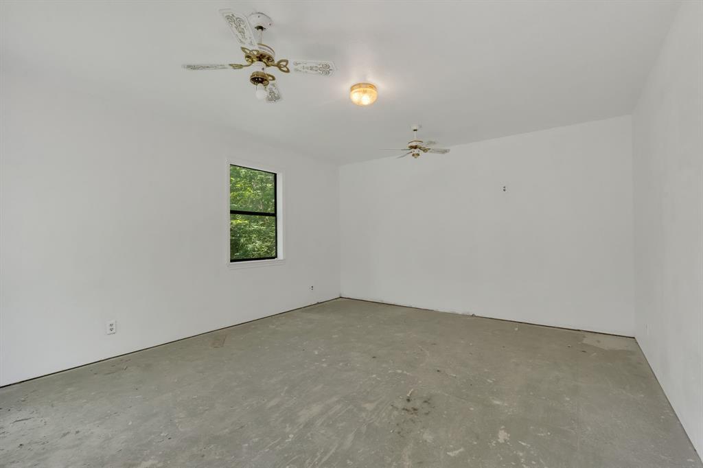 84 Natchez Road Pottsboro, TX 75076 - Photo 36 of 37 an empty room with windows and fan