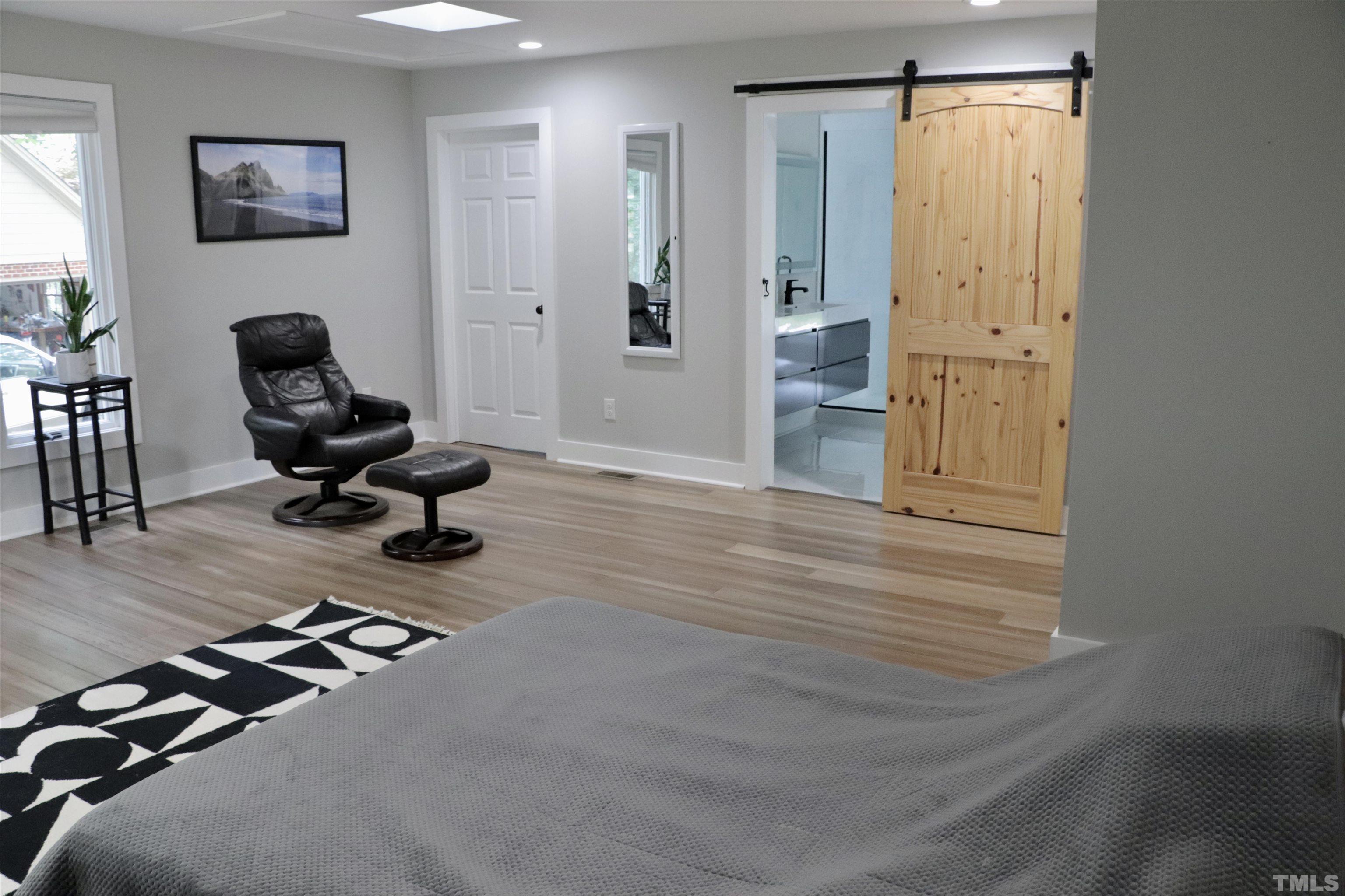 8001 Shellnut Road Raleigh, NC 27615 - Photo 12 of 22 a view of a workspace with furniture and a window