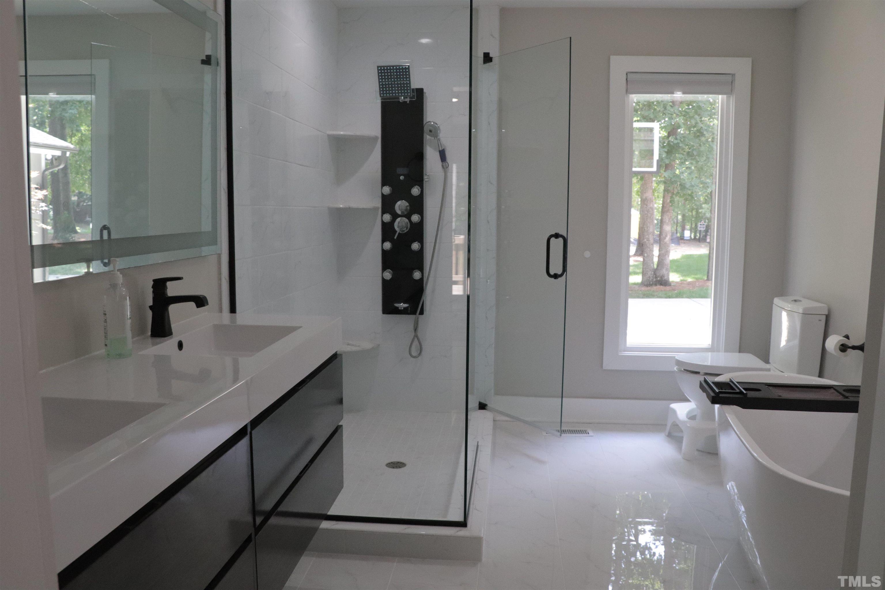 8001 Shellnut Road Raleigh, NC 27615 - Photo 14 of 22 a bathroom with a sink and a window