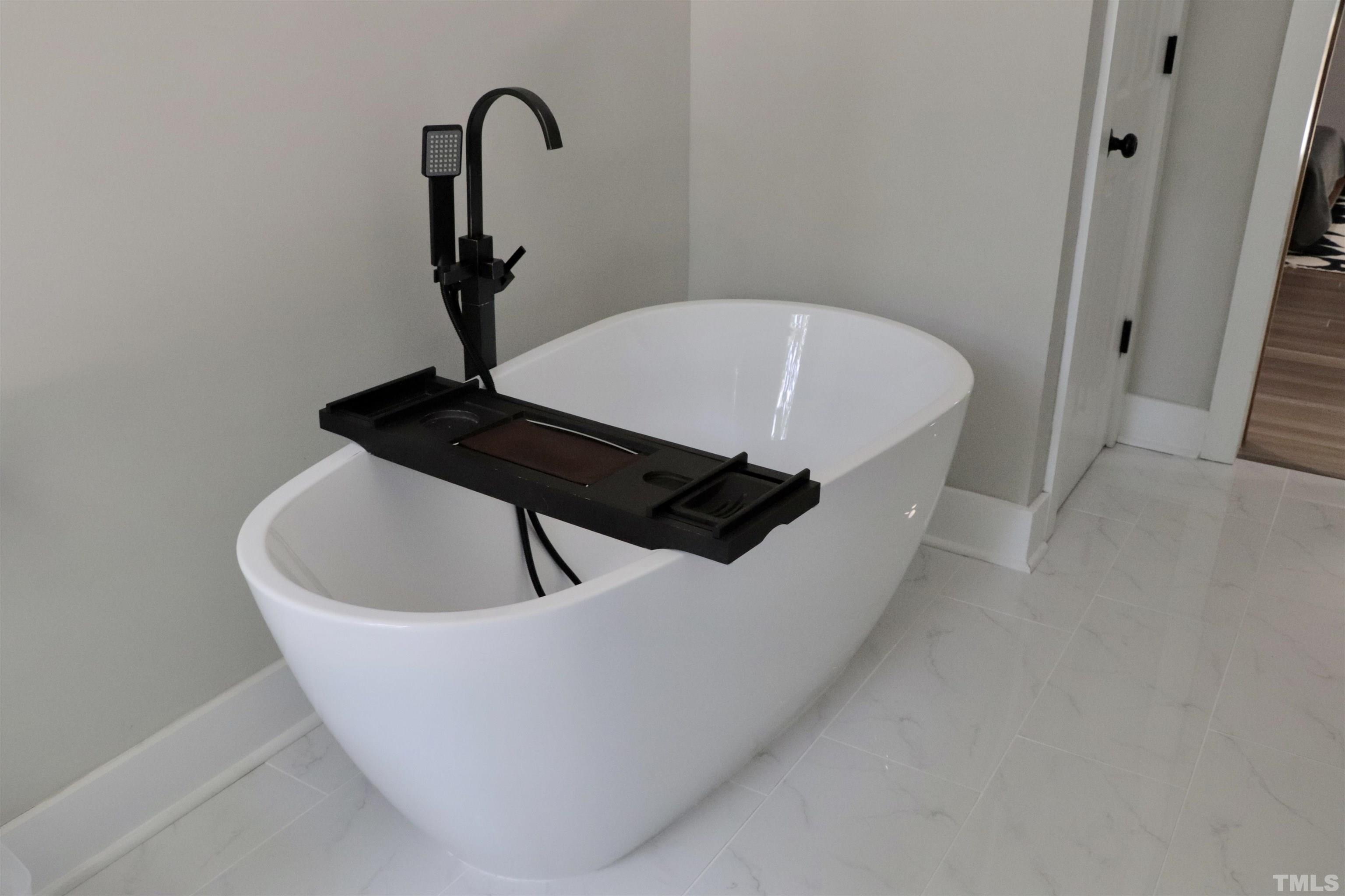 8001 Shellnut Road Raleigh, NC 27615 - Photo 15 of 22 a close view of a sink and bathtub in a bathroom