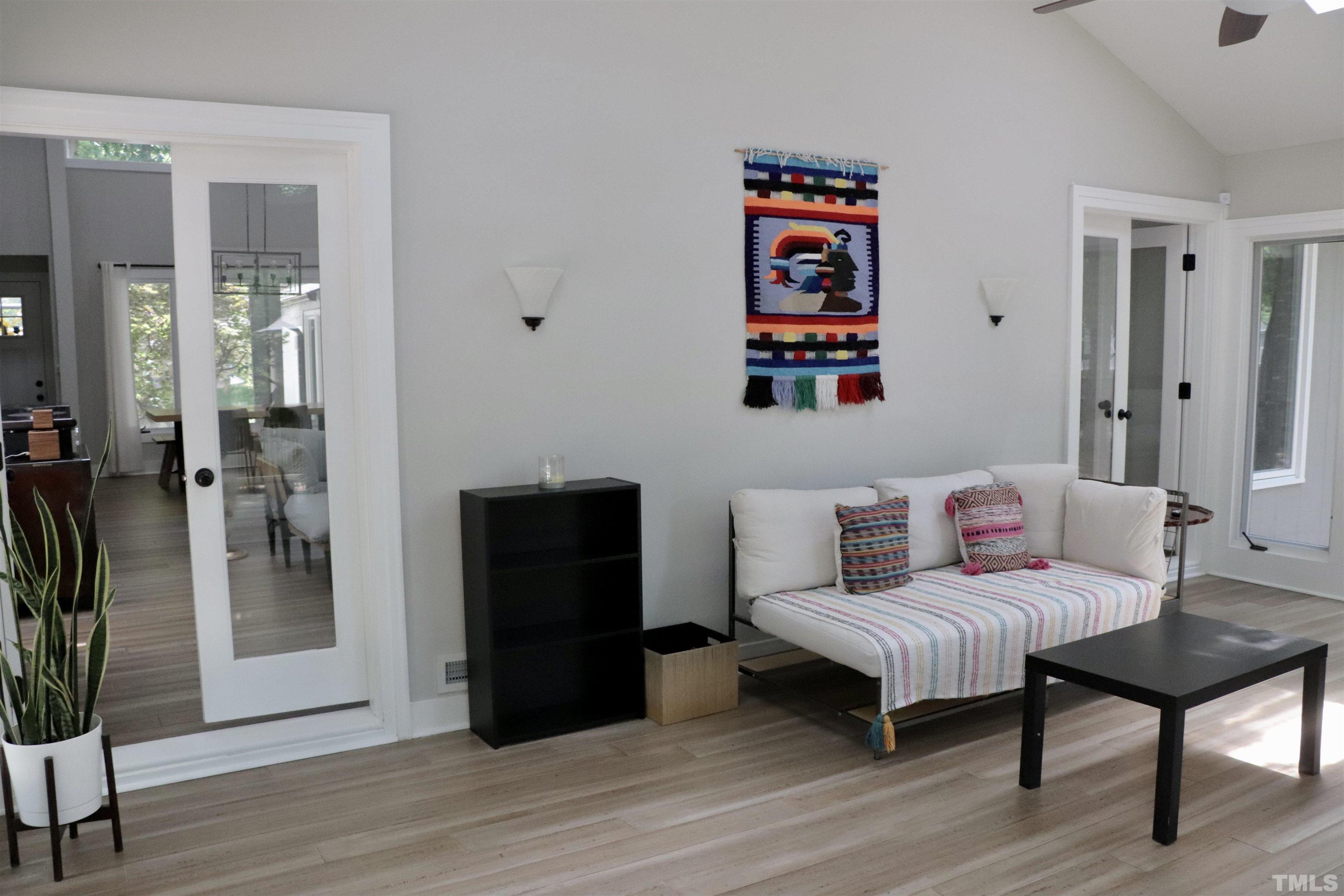8001 Shellnut Road Raleigh, NC 27615 - Photo 17 of 22 a living room with furniture and a wooden floor