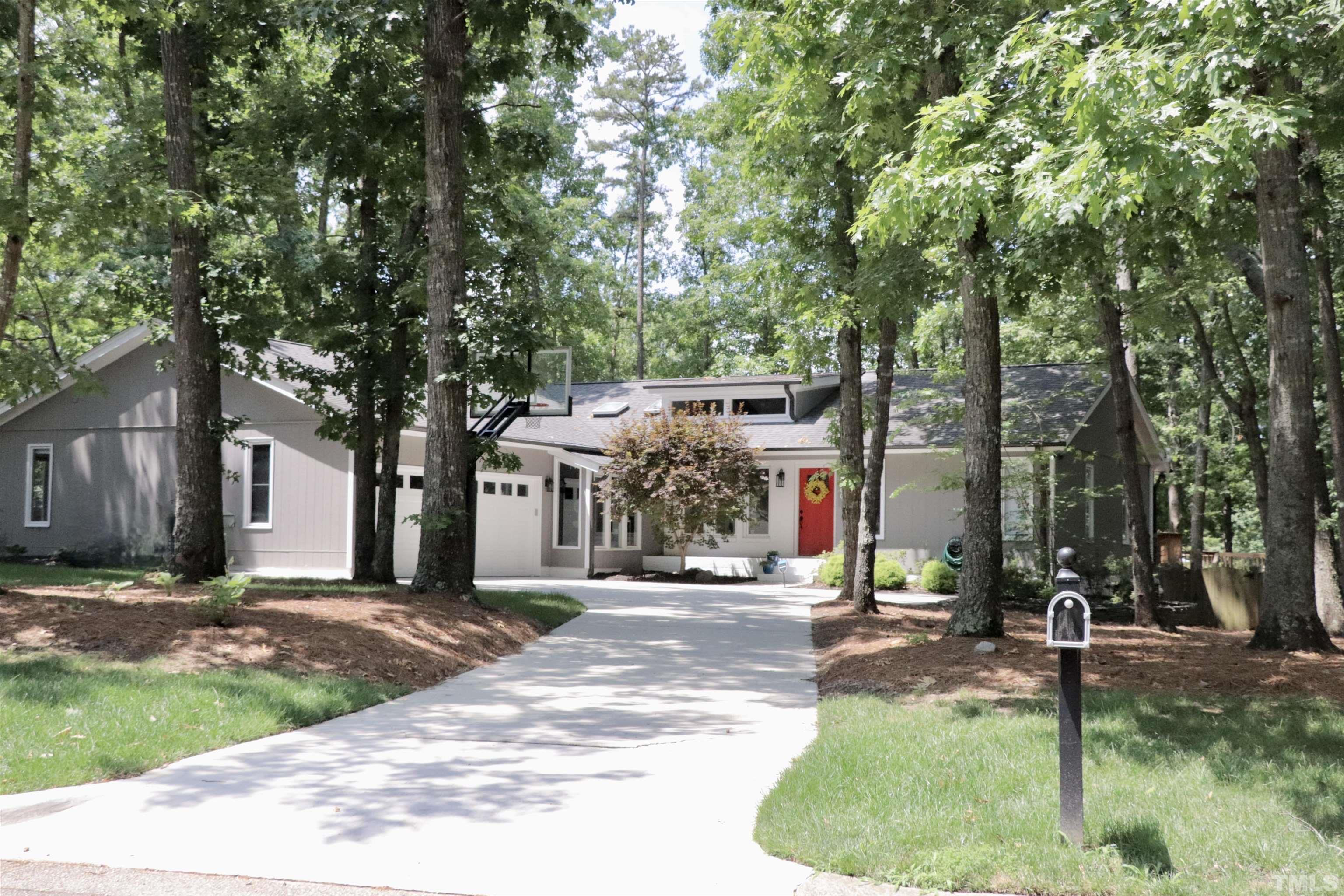 8001 Shellnut Road Raleigh, NC 27615 - Photo 2 of 22 a view of a park with plants and large trees