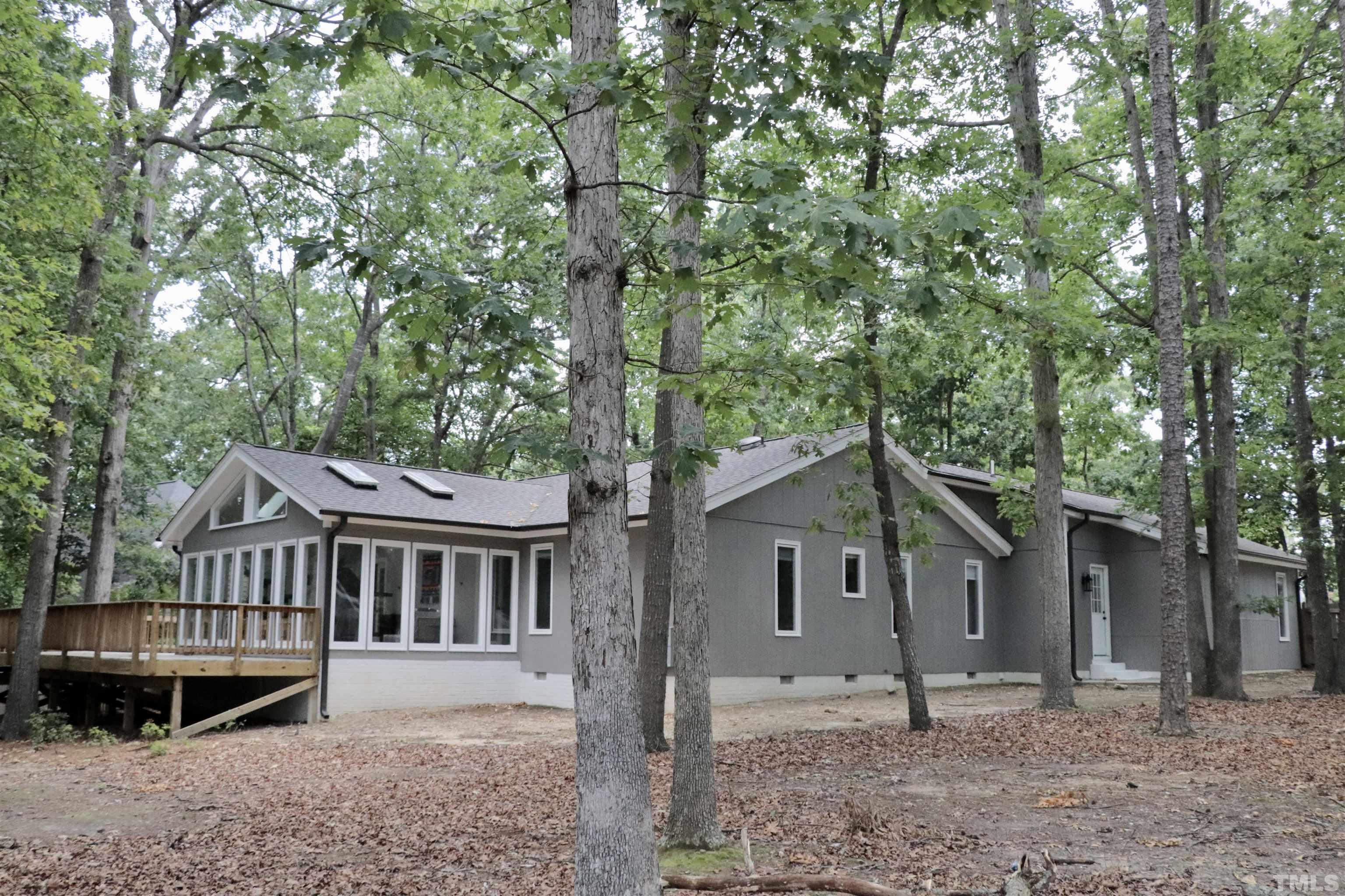 8001 Shellnut Road Raleigh, NC 27615 - Photo 22 of 22 a front view of a house with a garden