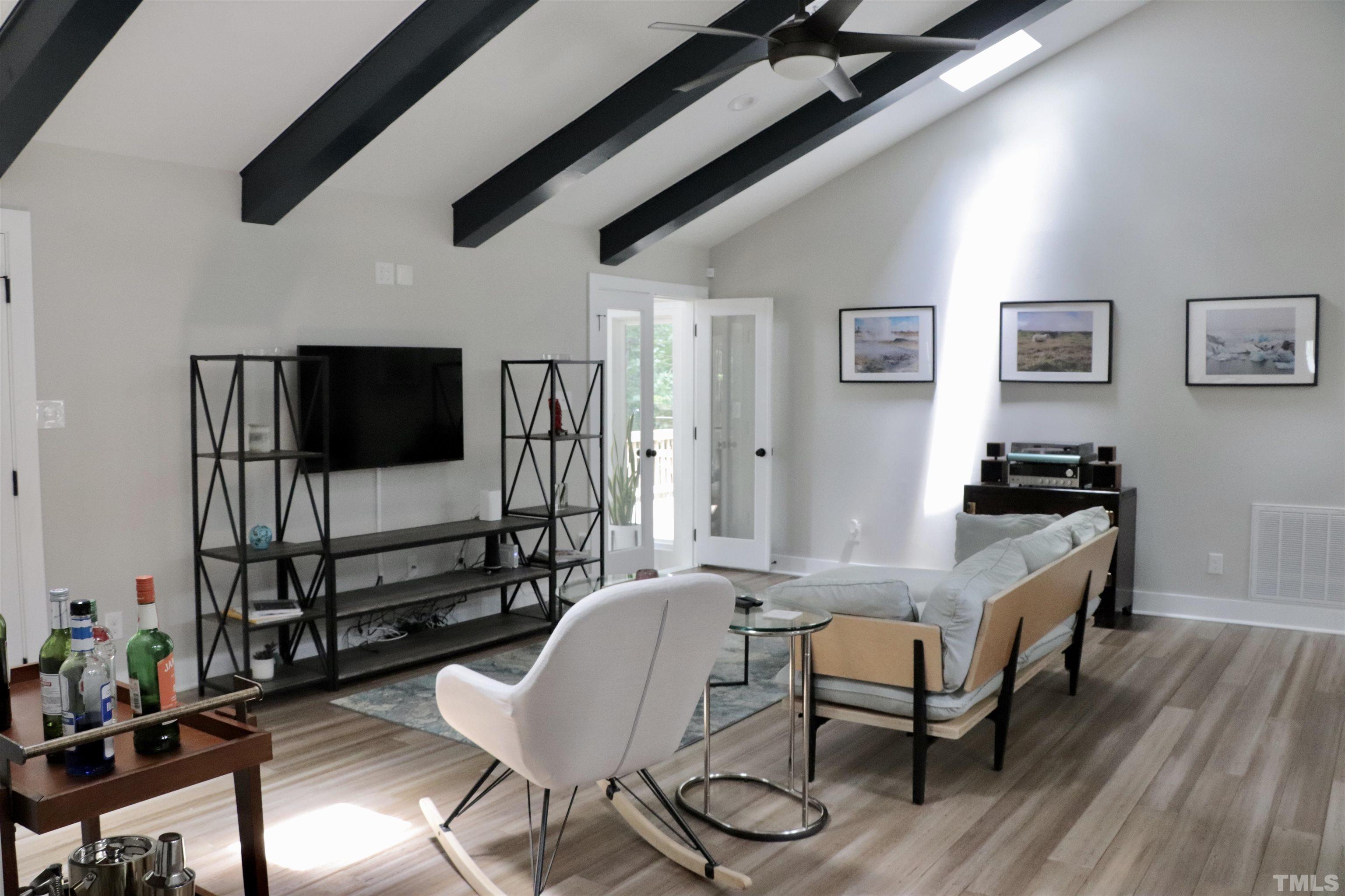 8001 Shellnut Road Raleigh, NC 27615 - Photo 4 of 22 a living room with furniture and a flat screen tv