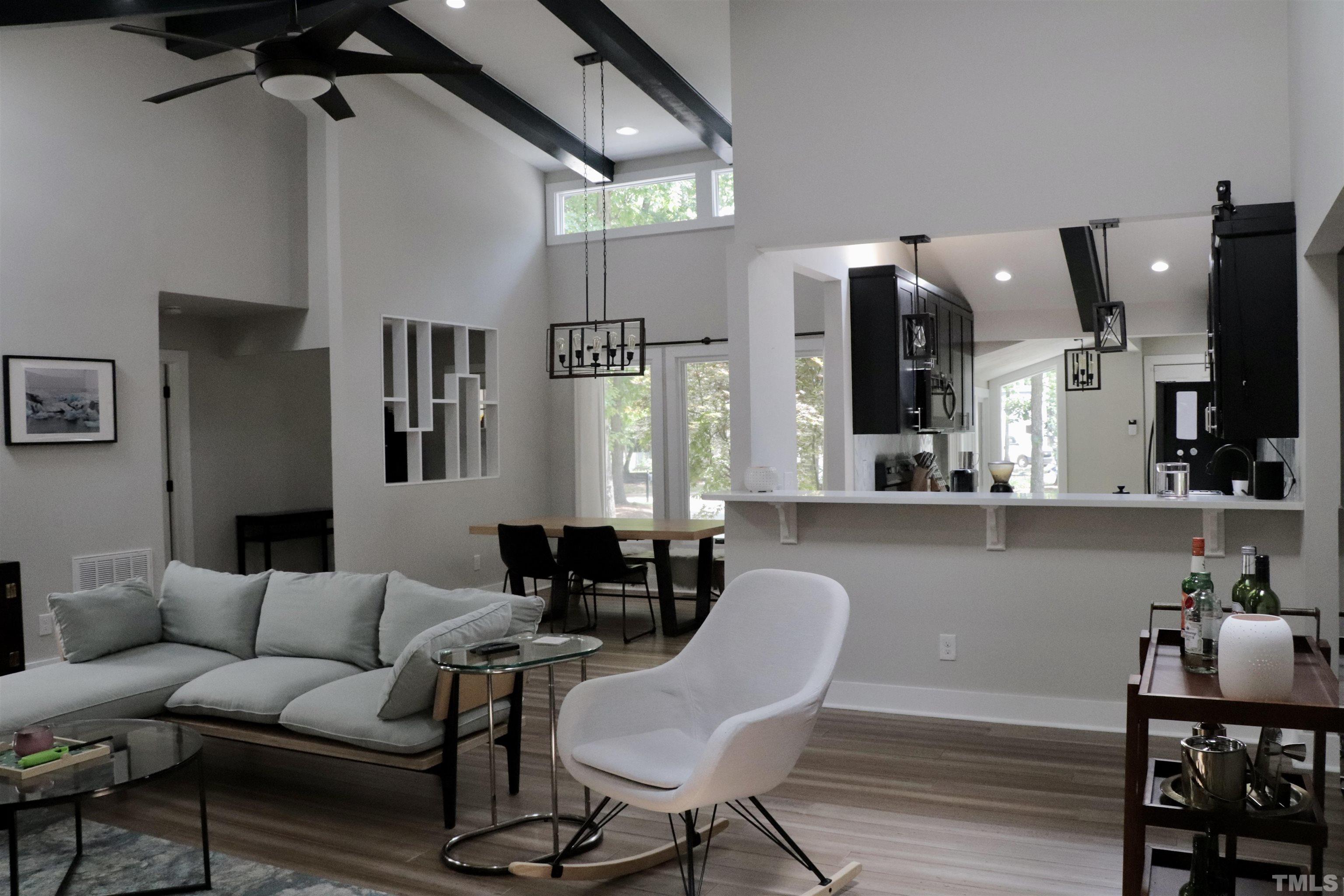 8001 Shellnut Road Raleigh, NC 27615 - Photo 5 of 22 a living room with furniture and a flat screen tv